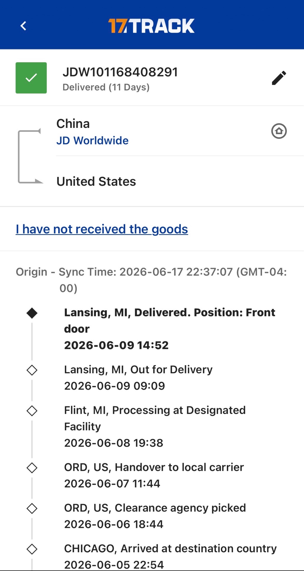17TRACK tracking screen showing package JDW101168408291 delivered to front door in Lansing, MI